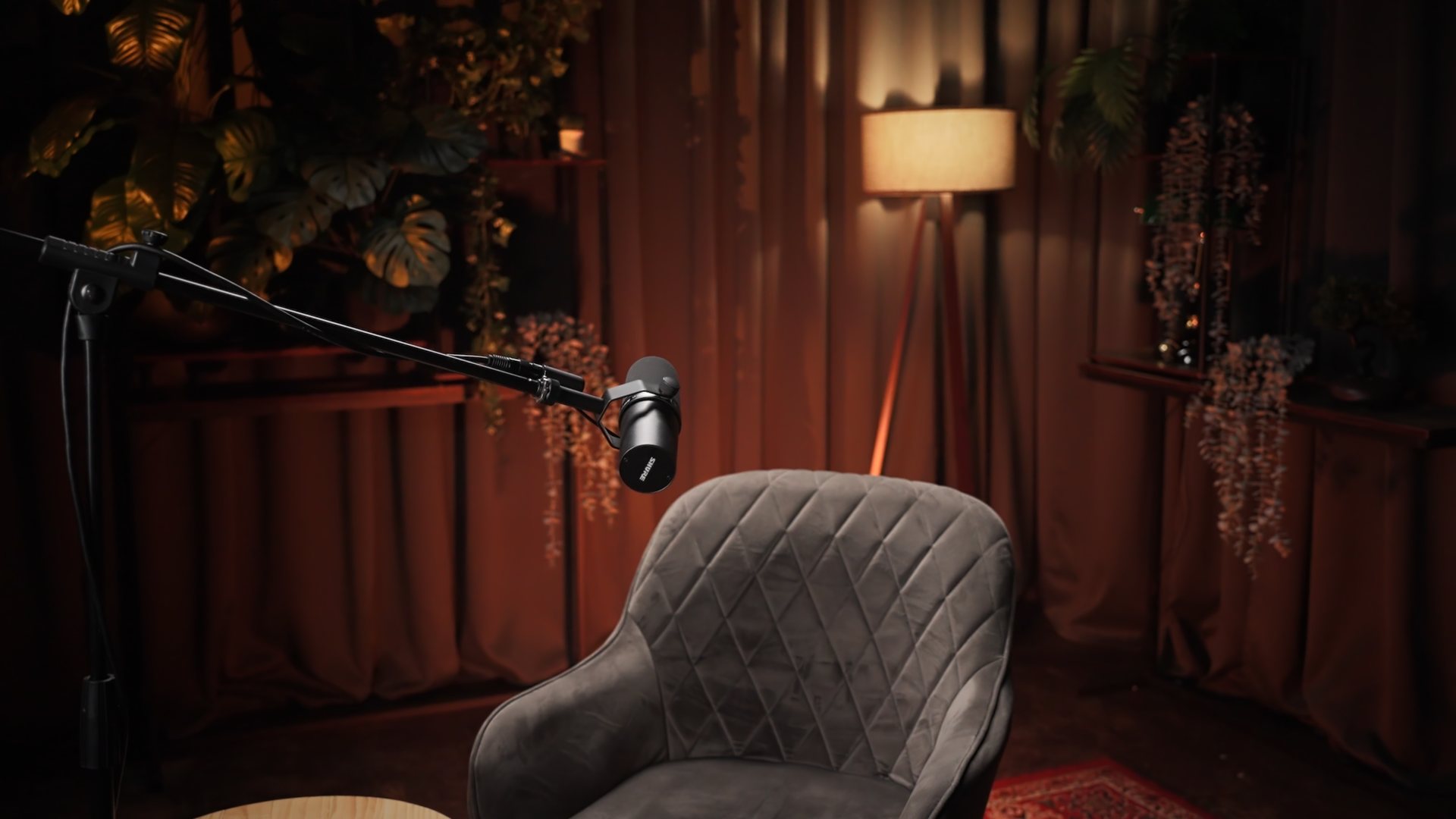Podcast set with microphone and armchair at VYSE studio in Riga